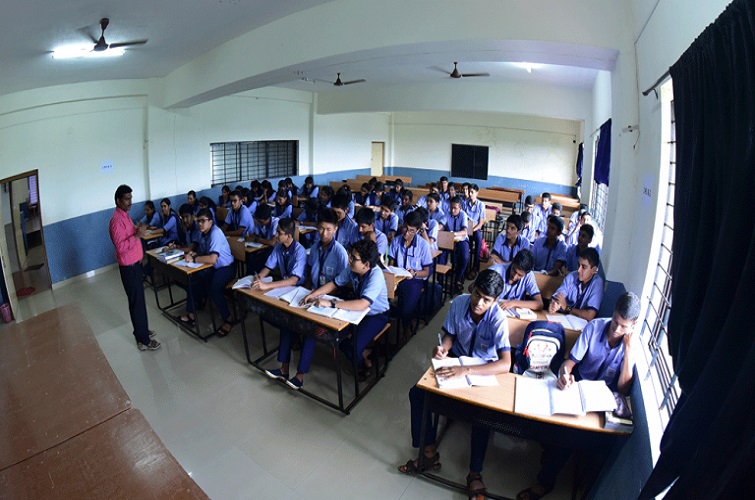 Students attending class at Sharada PU College in Mangalore with well-furnished classrooms